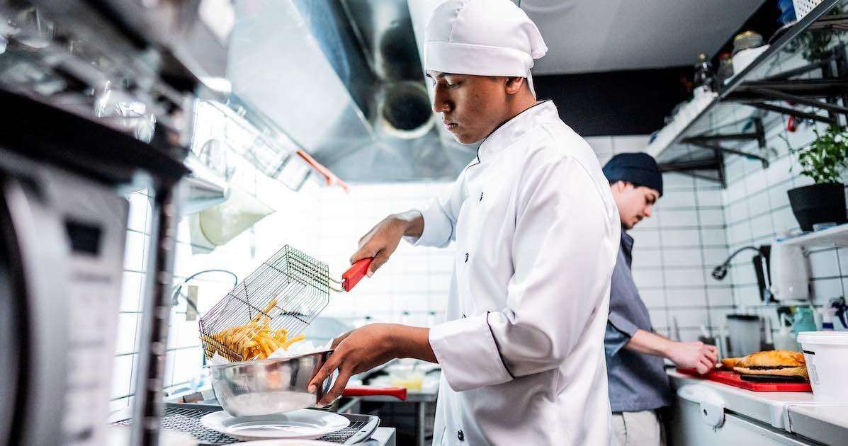 chef preparing gourmet french fries