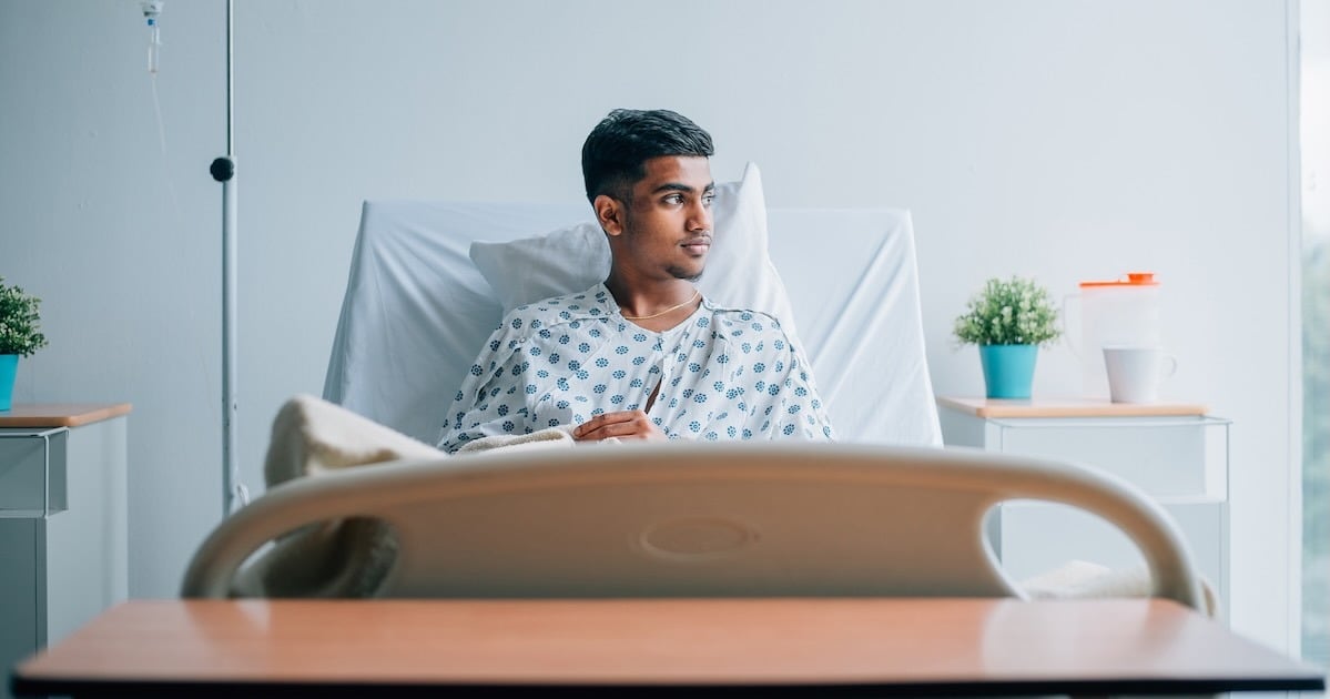 hospital patient sitting in hospital bed