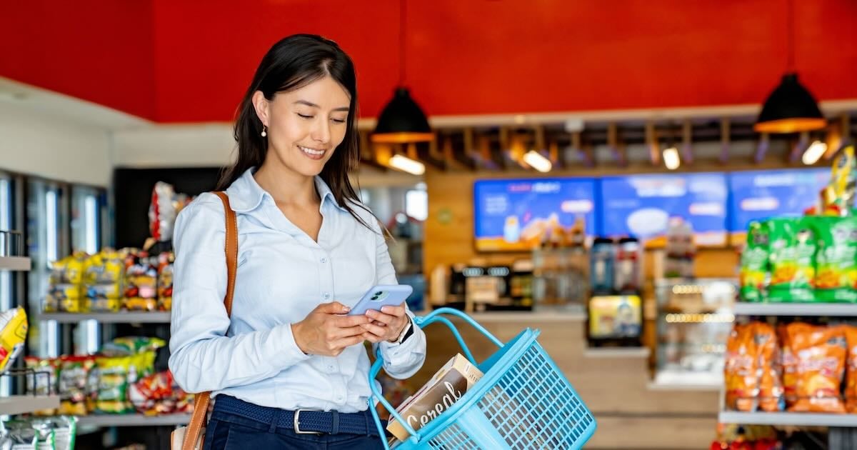 C-Store customer looking at her phone