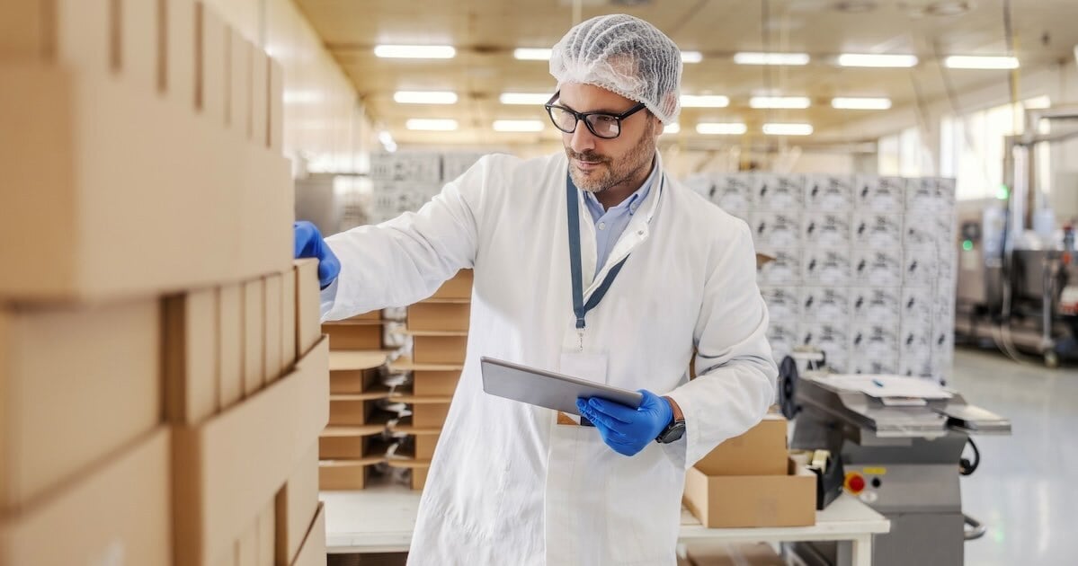 quality control professional examining boxes