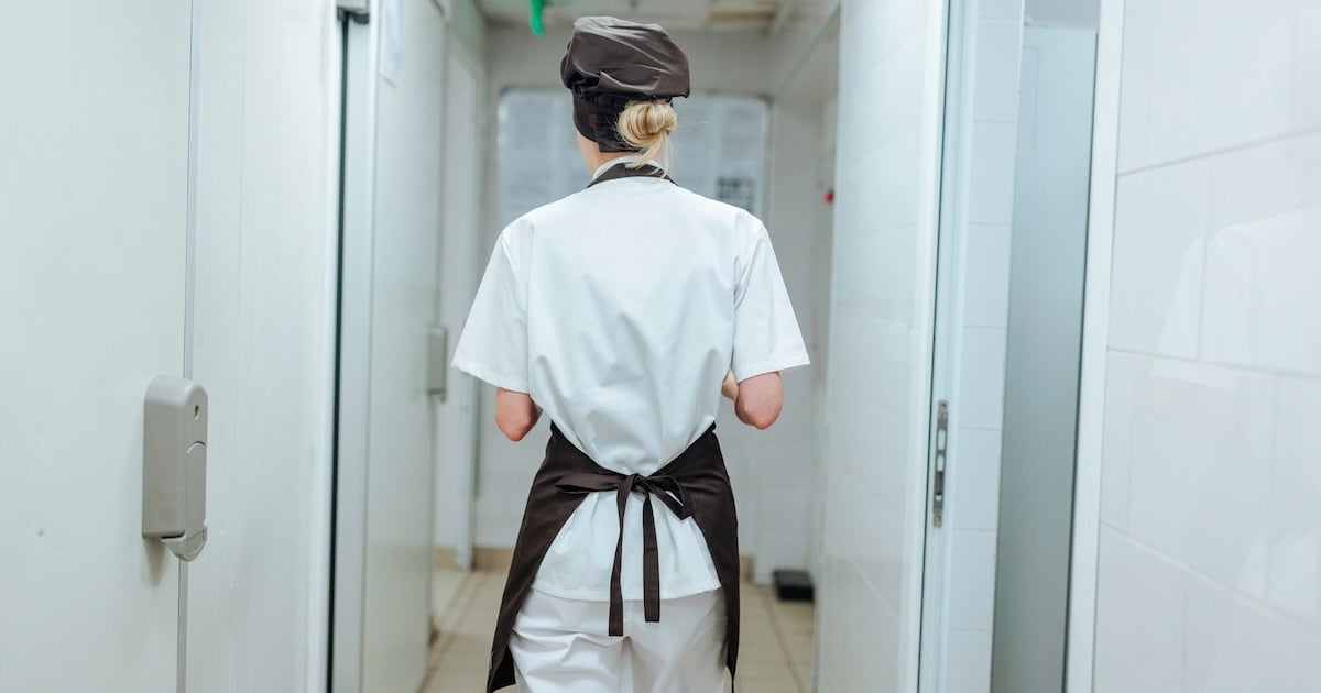 chef walking in the back hallway of the restaurant