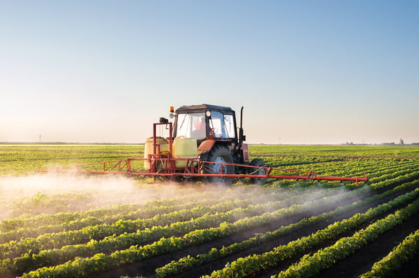 tractor spraying pesticide